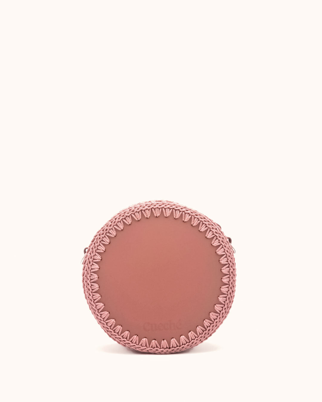 Bolso redondo pequeño artesanal rosa de cuero y crochet hecho a mano por Cueché